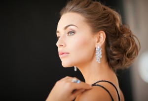 beautiful woman in evening dress wearing diamond earrings