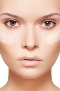 Skin care & cosmetics. Woman applying skin tone foundation