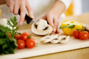 female chopping food ingredients