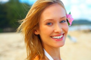 Fashion shot of beautiful blonde woman on the beach in Hawaii